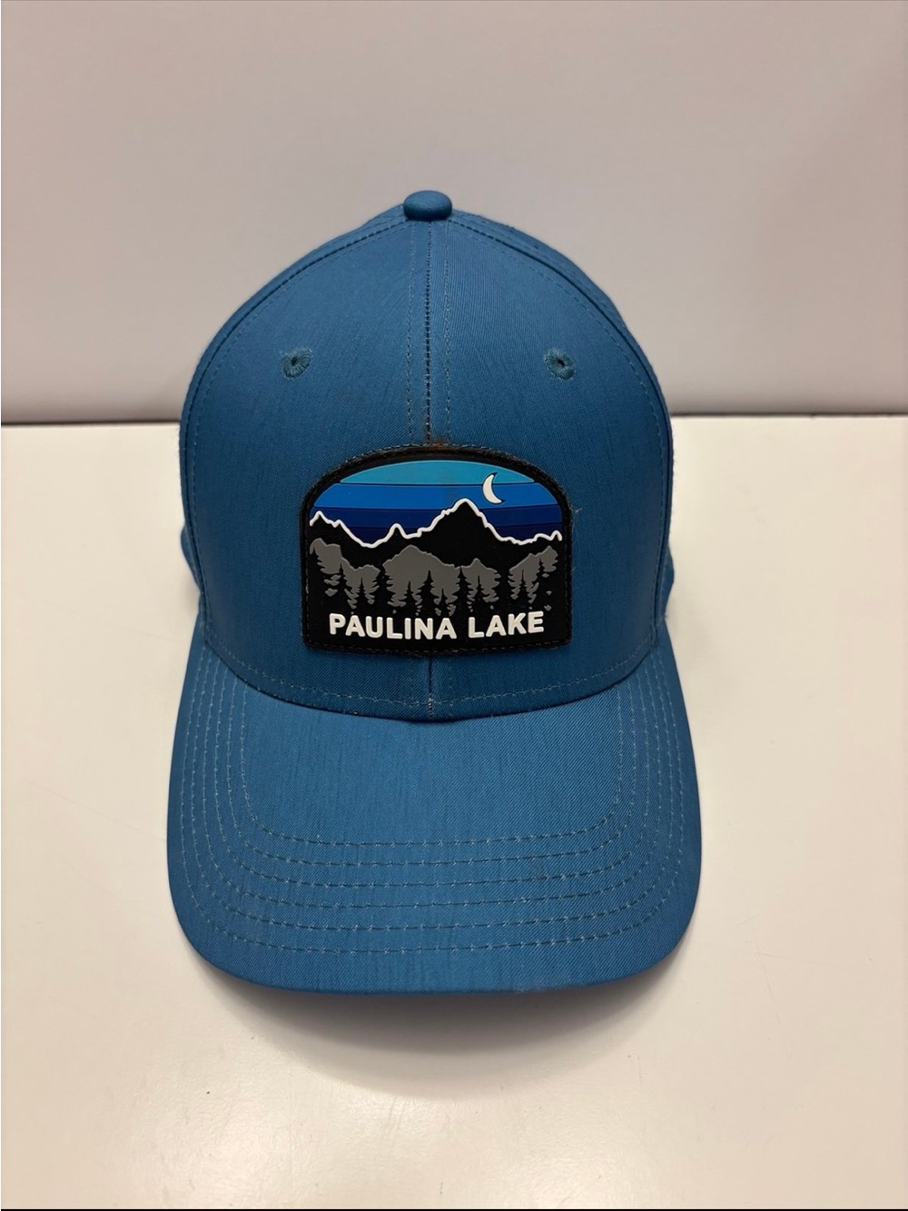 Legacy blue “Paulina lake” trucker cap